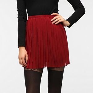 Urban Outfitters red pleated mini skirt, size XS.